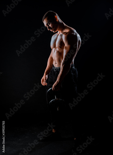 Fitness muscular body on dark background