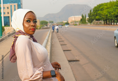 Portrait of beautiful Muslim woman standing by the road side 
