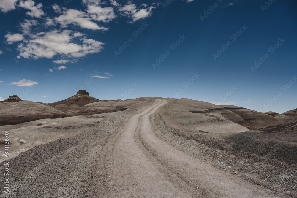 Dirt Road cuts into desert ground