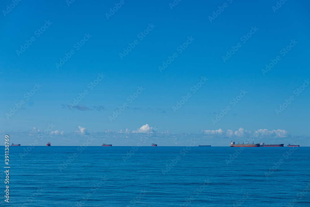 Anchorage of eight cargo ships off coast Coral Sea