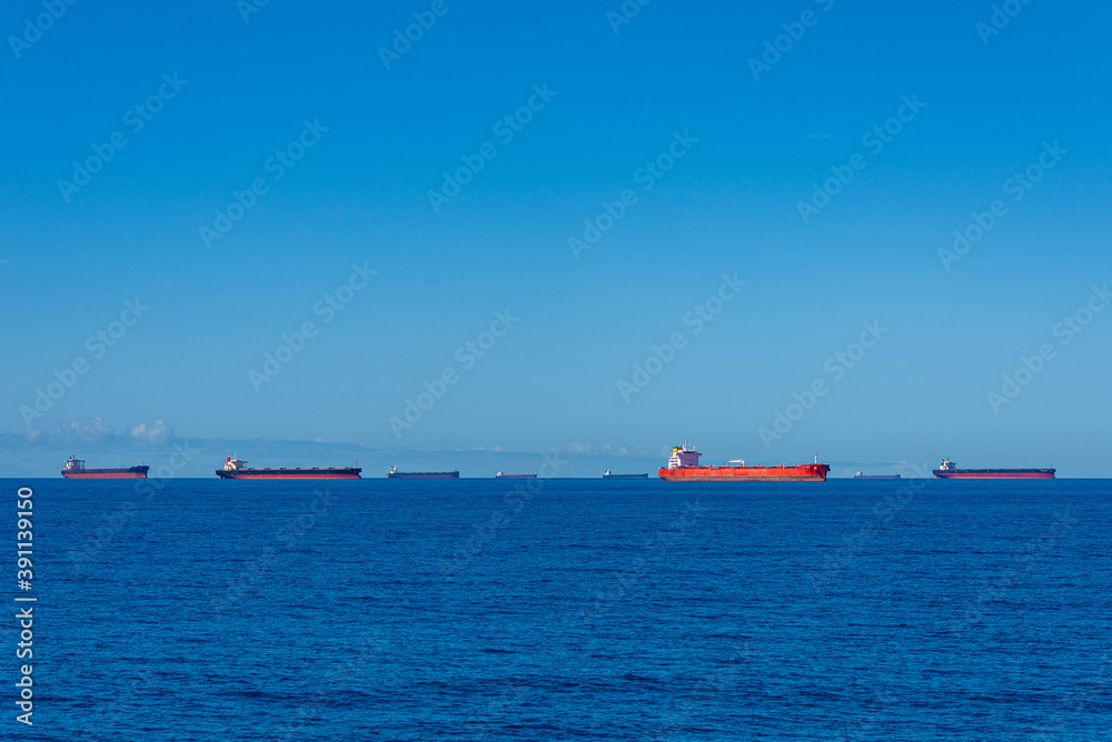 Multiple cargo ships anchorage Coral Sea