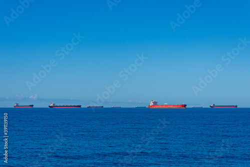 Multiple cargo ships anchorage Coral Sea