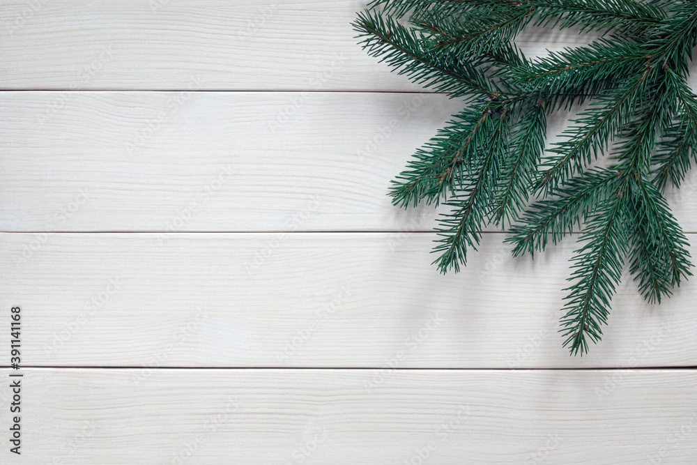 fir tree twigs without ornaments on white wooden background fir tree twigs without ornaments on white wooden background