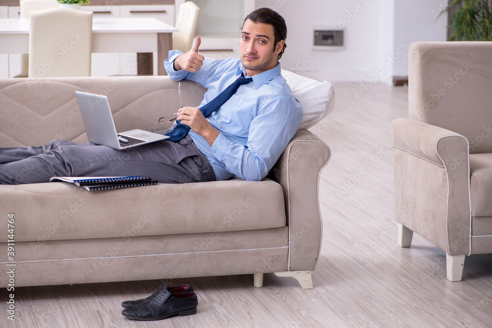 Tired businessman employee working from home