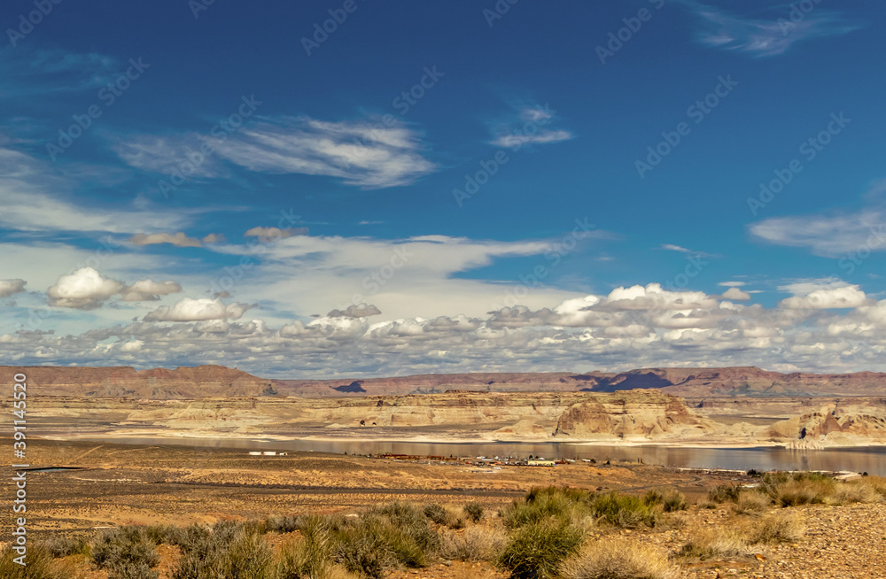 Rolling clouds and teal blue skies above the marina and the river, Wahweap lookout, Page, AZ