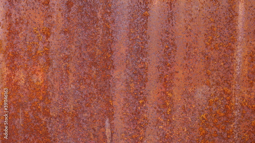 Old rusted steel plate background. Grunge background of weathered red brown metal surface Due to its chemical reaction with water and air. Selective focus