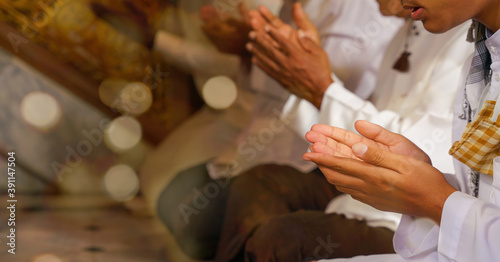 muslim people pray in islam ceremony in mosque during islamic ramadan photo