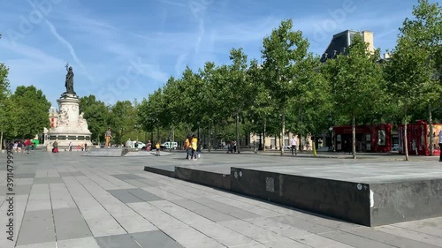 Time lapse footage of people walking and skating at famous city square called 