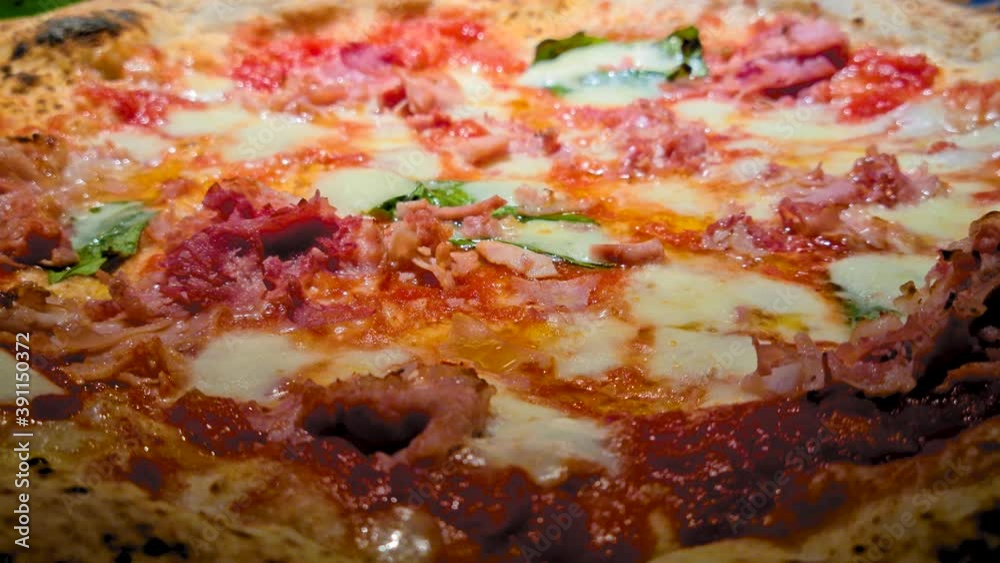 Close up of neapolitan pizza in traditional pizzeria restaurant in Naples Italy. Authentic deliicous food cuisine Close up of neapolitan pizza in traditional pizzeria restaurant in Naples Italy. Authentic deliicous food cuisine