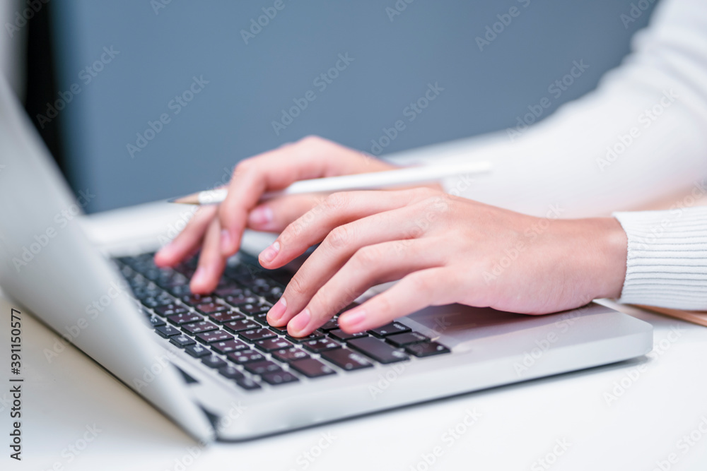Close up typing on keyboard work from home using laptop computer technology small business owner freelance innovative skill independent planning thinking ideas working late at night living room Close up typing on keyboard work from home using laptop computer technology small business owner freelance innovative skill independent planning thinking ideas working late at night living room