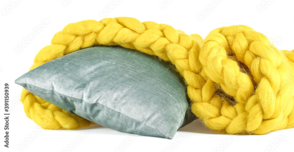 Yellow knitted plaid with pillow on white background Yellow knitted plaid with pillow on white background