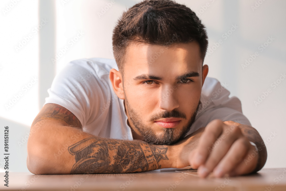 Obraz premium Fashionable young man on white background