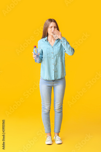Woman with problem of excessive thirst on color background. Diabetes symptoms