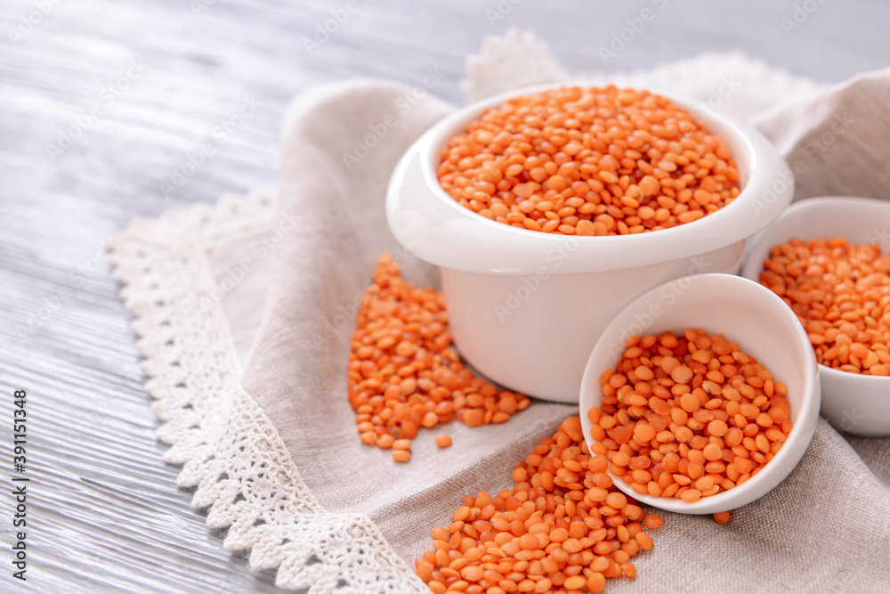 Composition with raw lentils on wooden table Composition with raw lentils on wooden table