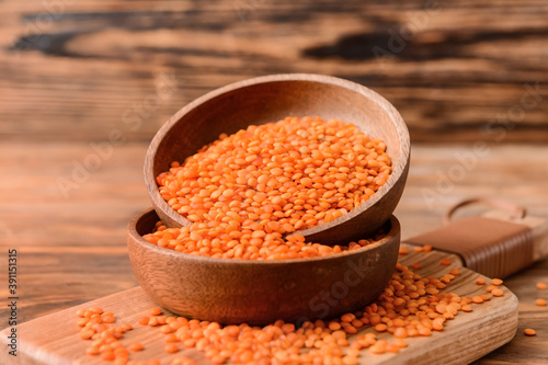 Red lentils in wooden bowls...