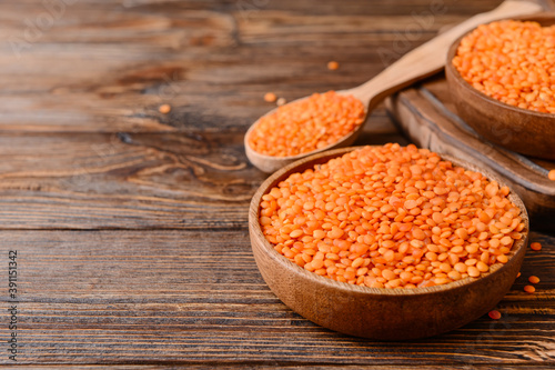 Red lentils in wooden bowls...