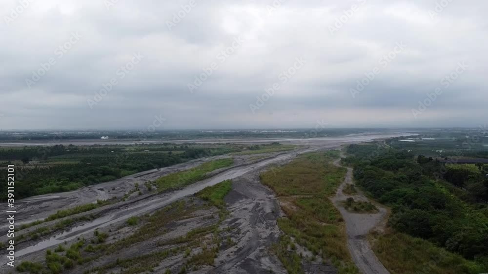 flying down over a rural area in Taiwan with a bridge on a cloudy day flying down over a rural area in Taiwan with a bridge on a cloudy day