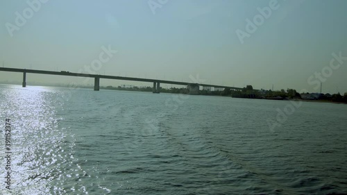Wallpaper Mural Traffic. Automobile bridge over a wide river against the background of a blue sky. Long shot. Torontodigital.ca