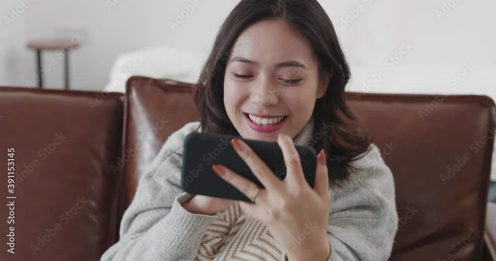 Close up of Pretty young Chinese woman having video call with friend at home lovely Asian girl chatting online using mobile phone with friends stay at home Close up of Pretty young Chinese woman having video call with friend at home lovely Asian girl chatting online using mobile phone with friends stay at home