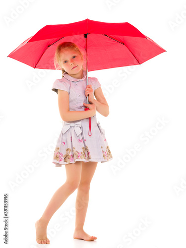 Little girl under an umbrella.Concept style and fashion. Isolated on white background. © lotosfoto
