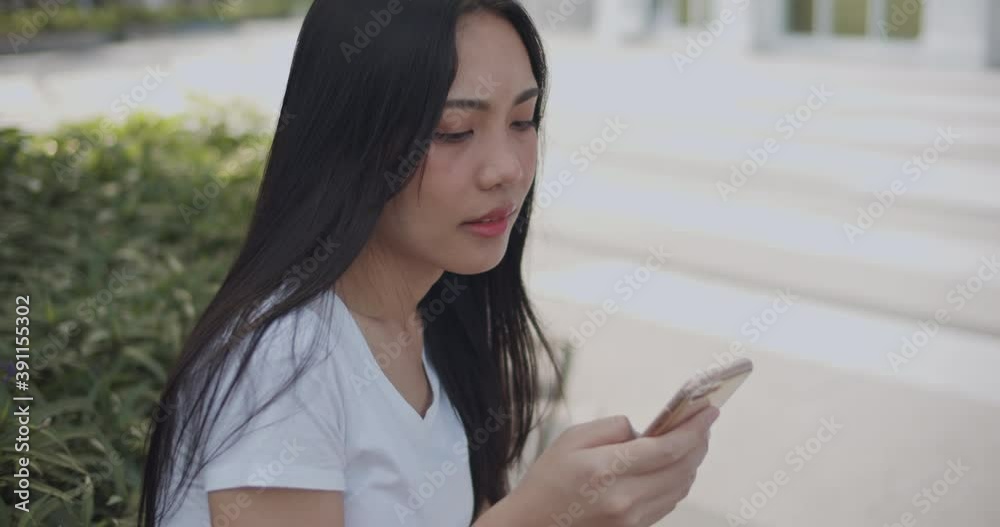 Young woman Asian using mobile phone for communication. Young woman Asian using mobile phone for communication.