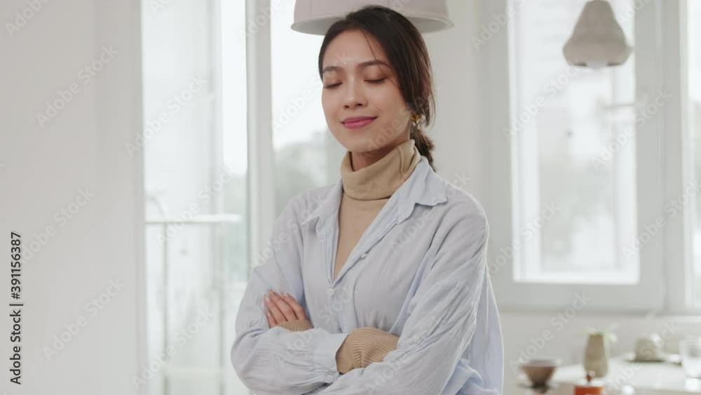 Portrait of one young pretty asian businesswoman looking at camera smile beautiful confidence Chinese woman smile at camera in home office Portrait of one young pretty asian businesswoman looking at camera smile beautiful confidence Chinese woman smile at camera in home office