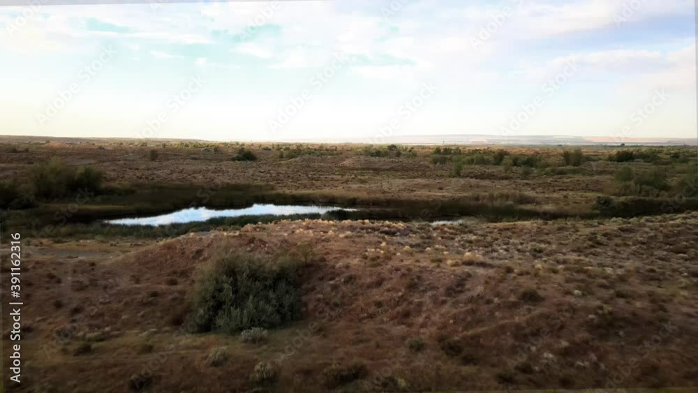 Small lakes surrounded by desert scrubland and marsh, Potholes, Washington, aerial Small lakes surrounded by desert scrubland and marsh, Potholes, Washington, aerial