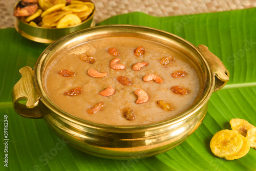 Parippu Payasam Pradhaman  or Moong Dal Kheer Indian sweet Kerala food for Onam festival special dessert Mithai for Onam sadya , sadhya in green banana leaf background. Also popular Sri Lankan food .  photo