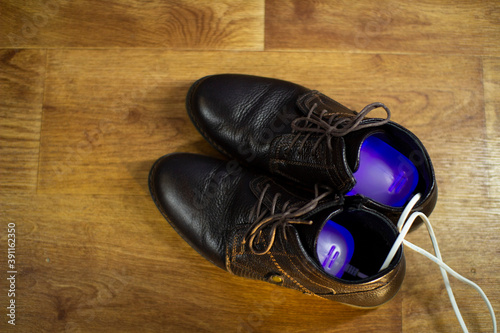 Electric ultraviolet Shoe dryer. Shoe care. © andreysha74