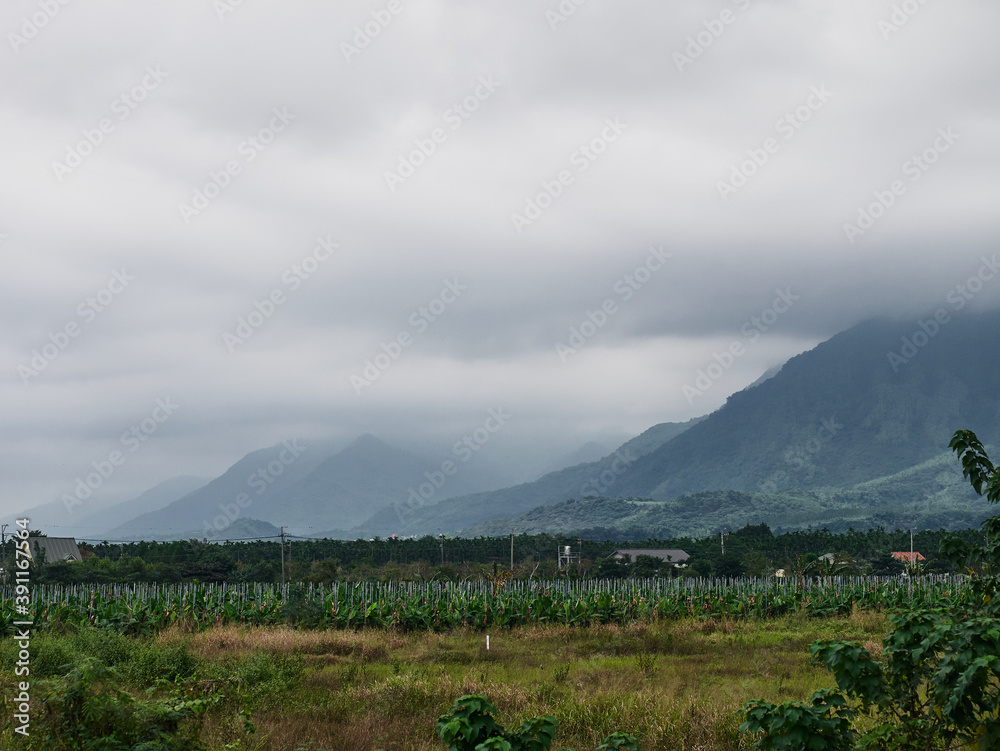 scenic view of rural region and mountain range in Pingtung region. Taiwan. scenic view of rural region and mountain range in Pingtung region. Taiwan.