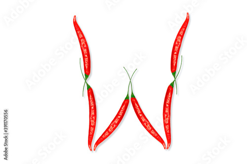 Alphabet letter W made from red hot chili peppers. Letter isolated on white background.