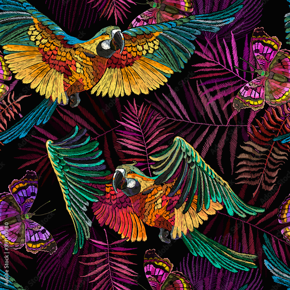 Tropical parrots, butterflies and palm leaves. Embroidery. Seamless pattern. Macaws. Jungle paradise art. Fashionable template for design of clothes, textiles