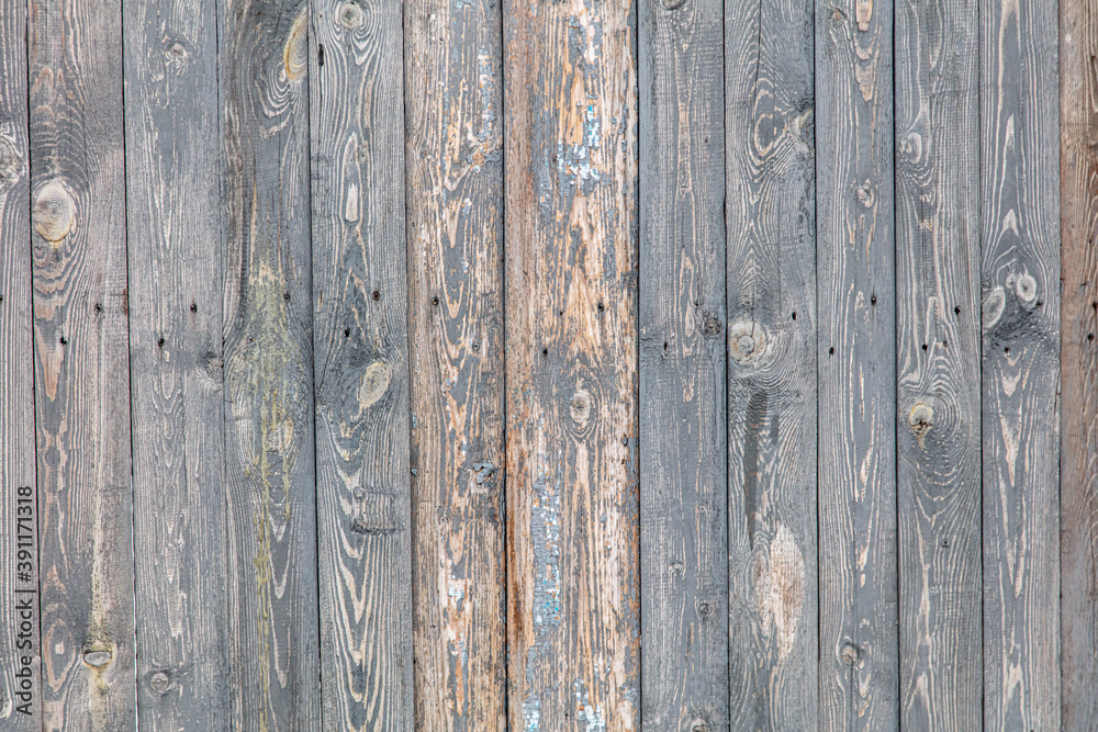 Naklejka premium Wooden boards on an old fence as an abstract background.