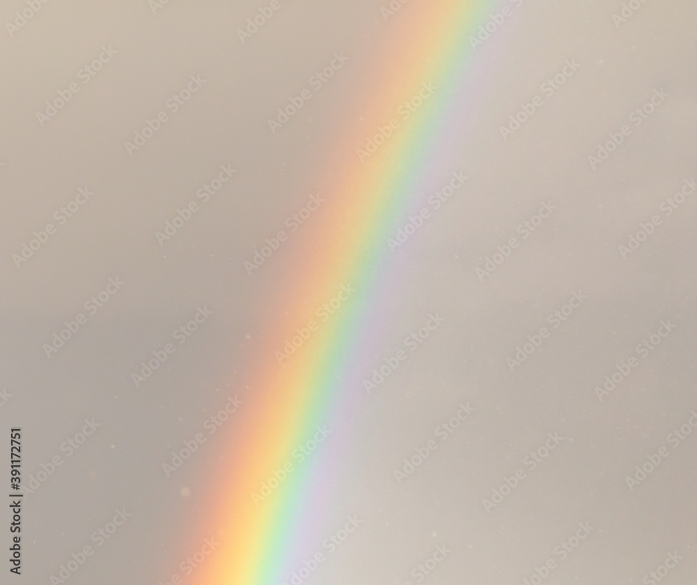 Rainbow in the sky against the background of clouds. Rainbow in the sky against the background of clouds.