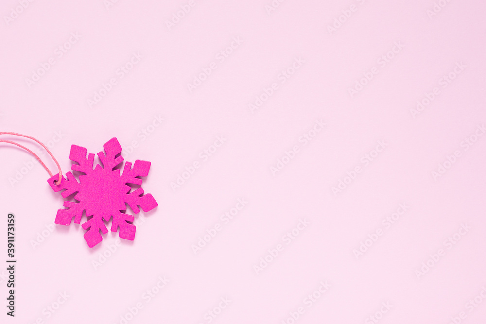 Pink snowflake on a light pink background.