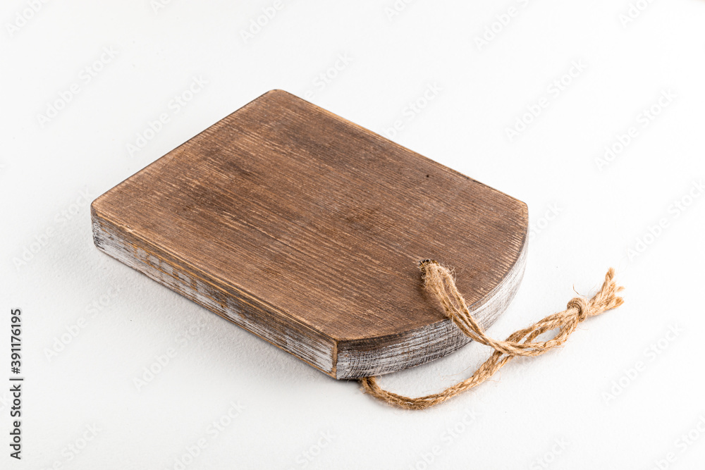 Fototapeta premium Side view on isolated wooden cutting board
