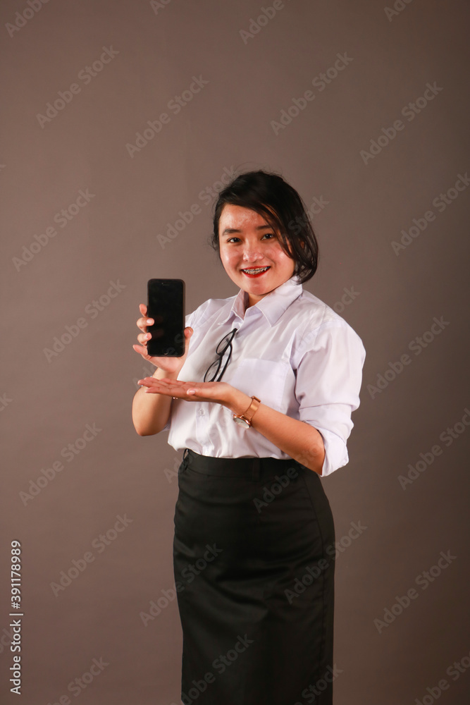 Happy oriental Asian young executive using mobile phone. Happy oriental Asian young executive using mobile phone.
