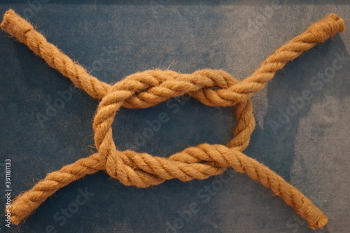 symbol of a sea knot made of rope on a blue background