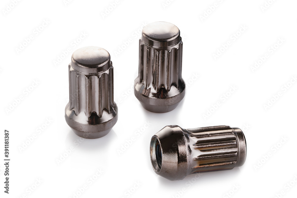 three grey shiny nuts for alloy wheels and auto tuning on a white isolate background three grey shiny nuts for alloy wheels and auto tuning on a white isolate background
