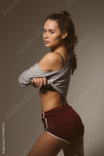 Sexy sports girl in a fashion photo shoot