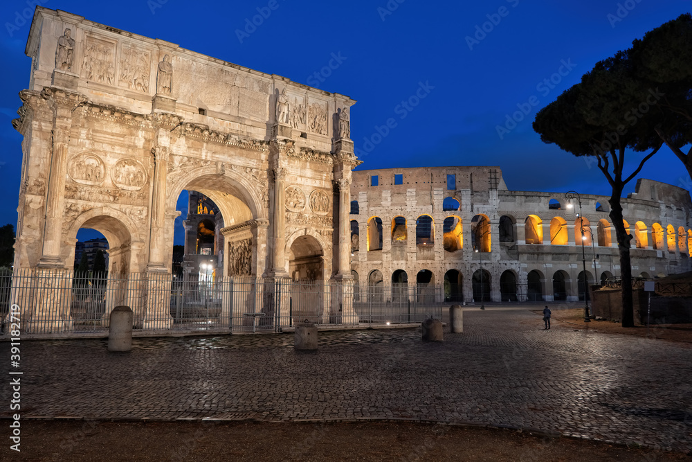 Arch of Constantine and Colosseum at Night in Rome, Italy