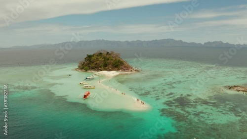 aerial seascape tropical island and sand beach, turquoise water and coral reef. malacory island, Philippines, Palawan. tourist boats on coast tropical island. photo