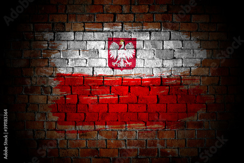 Poland flag painted on a brick wall in an urban location