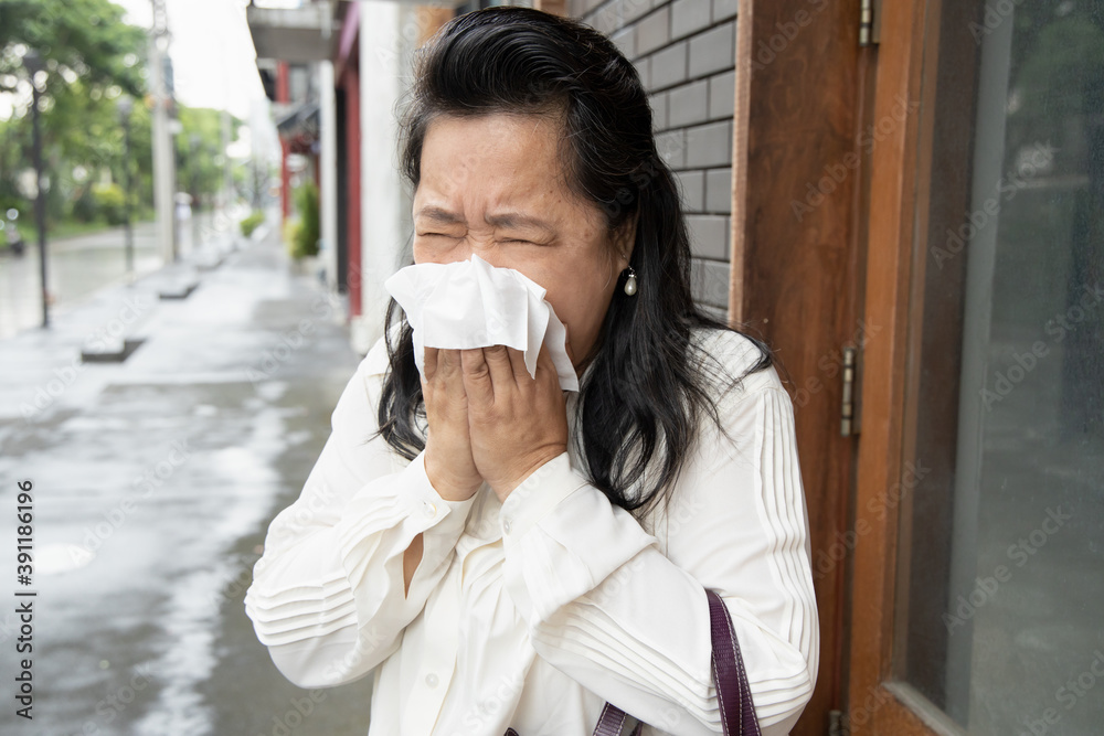sick allergic senior woman sneezing with cold, flu or allergy sick allergic senior woman sneezing with cold, flu or allergy