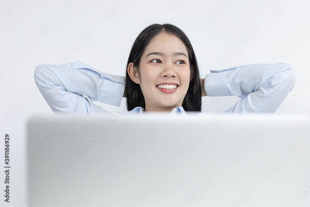 Asian businesswoman is relaxing after overtime working in a office, Happy women resting at work after work is finished.