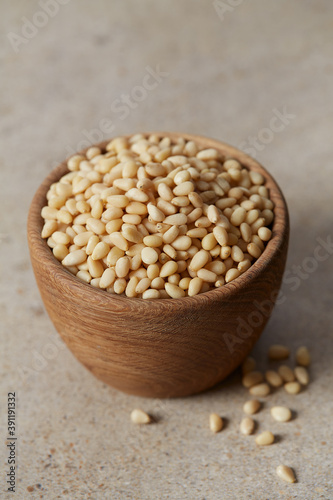 pine nuts in a wooden bowl