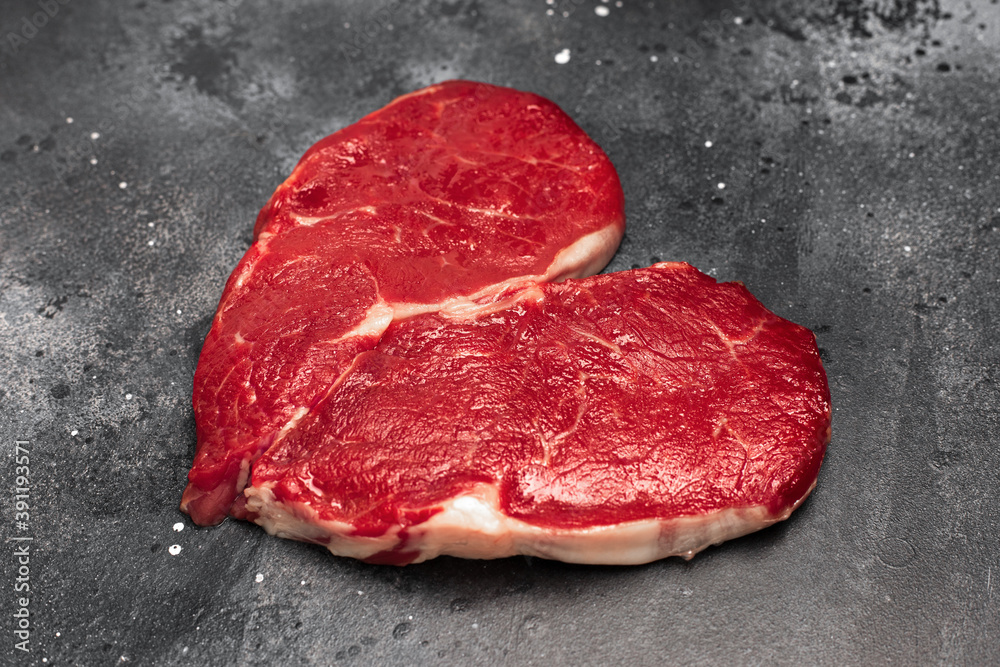 Heart shape Raw fresh meat Steak on dark background.