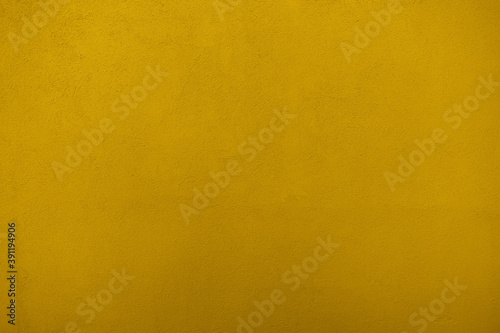 Texture of colored plaster. Yellow color. Finishing. Background