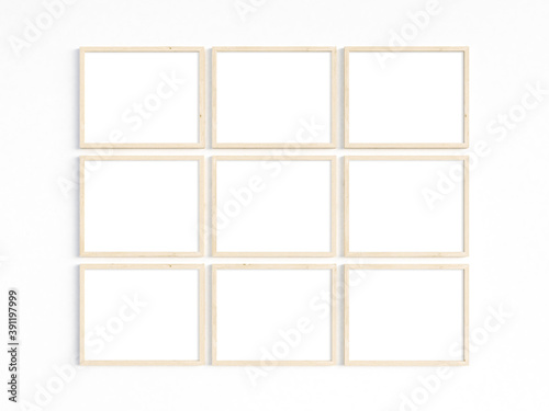 Nine thin wooden frames on a light wall