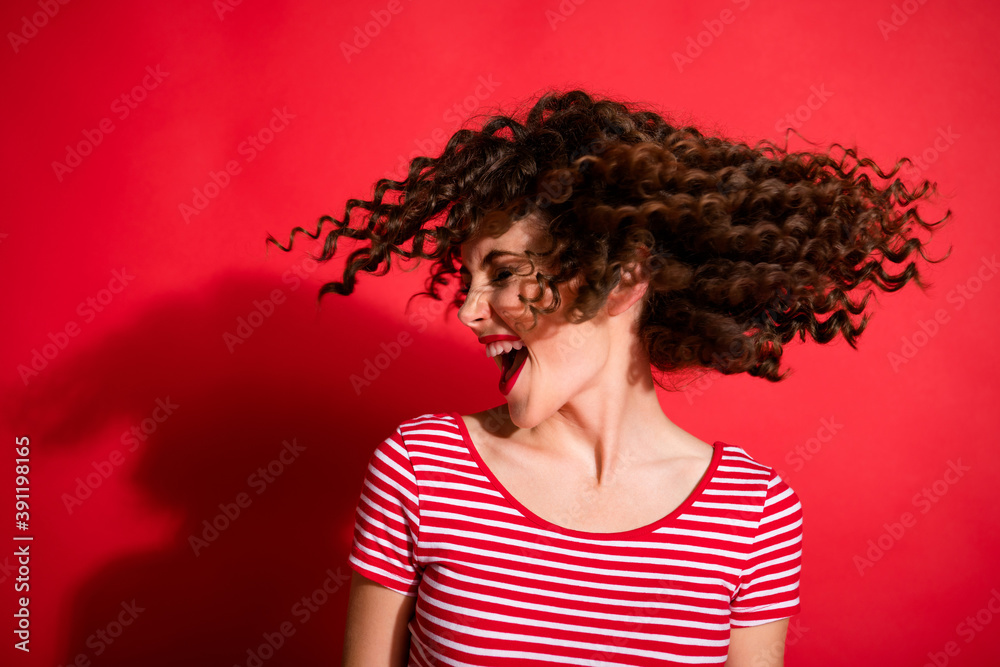 Photo of attractive curly brunette hair girl excited enjoy hair salon treatment isolated over red color background